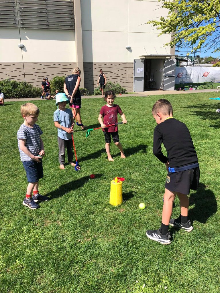 young children playing games after school